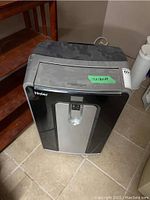 Front view of Haier portable air conditioner showing control panel and housing