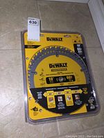 Photo of the front packaging of one Dewalt 10-inch saw blade showing brand, size, tooth count, and usage recommendations.