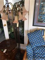 Full view of the ten-arm floor lamp showing height and overall form