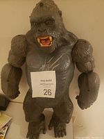 Front view of large gray King Kong toy showing detailed fur texture, open mouth, and muscular arms.
