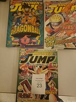 Photo showing three Shonen Jump comic books featuring Dragon Ball, Naruto, and Yu-Gi-Oh! covers in great condition
