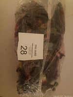 Plastic army soldiers and military toys wrapped in plastic packaging.