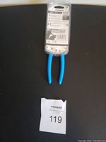 Photo of the back side of the blister packaging showing Channel Lock 7.5 inch pliers with blue handles and product information on the card.