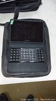 Blackberry tablet in carrying case with keyboard inside shown from above.
