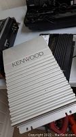 Kenwood mono power amplifier KAC 716 top view showing silver ribbed metal body with Kenwood branding.