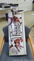 Guitar Hero guitar controller box with artwork and branding, showing overall packaging condition