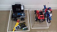 Photo showing all items in the lot: the Mopar black truck, the Radio Shack red RC car, the Tyco blue and red motorcycle, and the Accelerator X18 educational computer with accessories.
