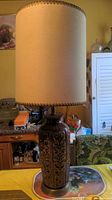 Full view of the mid-century modern ceramic table lamp with fabric shade showing overall shape, design, and stained shade.