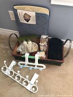 Photo of two Bellisimo memory foam bath mats folded and leaning against wall, one beige and one navy blue with quilted pattern.