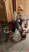Overall view of lot showing ceramic tree, cone trees, Santa figure, pyramid and ornament box