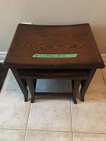 Top-down view showing the two nested tables with measurements on label.