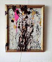 Front view of abstract painting in gold frame