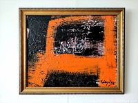 Front view of framed abstract oil painting showing orange and black impasto composition