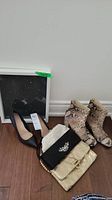 Lot showing two pairs of shoes, two clutches, and a framed artwork