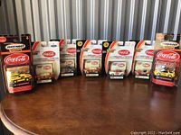 Seven Matchbox Collectibles vehicles in original packaging arranged in a row showing front package views