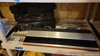 Bang & Olufsen Beomaster 2400 receiver and Sony cassette and CD players on shelf