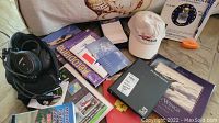 Overhead view showing headset, training books, cap and folded flag packaging
