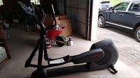 Front-left side view of elliptical in garage