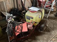 Side view showing full sprayer assembly on tow frame