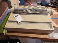 Front view of Apple ImageWriter II printer on wooden surface