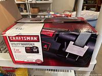 Photo of the unopened Craftsman Utility Sharpener box showing model details and branding.