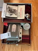 Polaroid Land Camera Model 850 with manual, flash, and case inside original box.