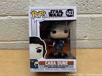 Front view of the Cara Dune Funko Pop figure in its box showing the figure and packaging details including series number 403.