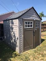 Front exterior view of shed showing color, style, and condition