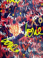 Close-up detail of layered graffiti text and color contrasts