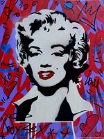 Close view of front showing Marilyn Monroe portrait with graffiti tags and hearts