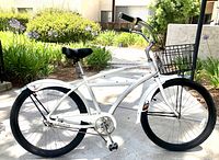 Front-left side view of complete bicycle with basket