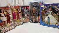 Photo showing all five boxed items: Jasmine figurine, two High School Musical 3 dolls, Camp Rock Shane figurine, and Hannah Montana playset.