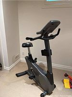 Front-side view of bike showing overall frame, seat, and base stabilizers