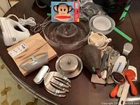 Full view of all items in the lot laid out on round dark table