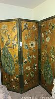 Front view of the folding screen showing peacock and flower design.