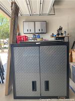 Wide view of Gladiator cabinet in garage showing full front and side profile