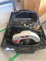 Craftsman circular saw inside black carrying case, showing the saw from angled side view.