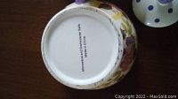 Bottom of the ceramic teapot showing text 'DECORATIVE PIECE DISHWASHER SAFE Made in China'