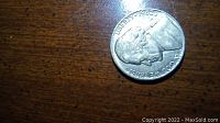 Photo focusing on the coin's obverse showing Liberty, 1982 year, and 'In God We Trust' text near the rim