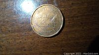 Top surface of 1988 Canadian penny listing wear and marks