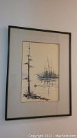 Full view of framed painting hanging on wall