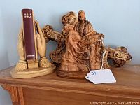 Photo showing entire set with Bible holder, Pietà sculpture, and crucifix in background