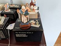 Hand-painted miniature figurine of Our Lady of Good Voyage on its original box.