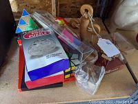 Variety of 3D dexterity puzzles including clear egg puzzle and wooden pieces