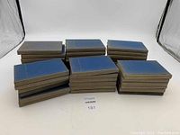 Photo of 42 hardback volumes of The Yale Shakespeare Book Collection arranged in stacks on white background.