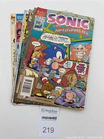 Stack of 6 comic books featuring Sonic The Hedgehog on top with colorful cover art.