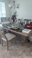 Full view of dining table with chairs and decorative items