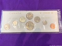 Front side of 1968 Canadian coin set showing coins in plastic holder with .800 silver and pure nickel coins clearly visible.