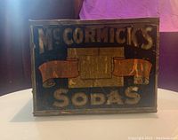 Front side of tin box showing 'McCormick's Sodas' and part of the label