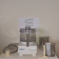 Photo of Cuisinart Pro Classic food processor with 7-cup capacity and multiple accessories including chopping blade and slicing/shredding discs.